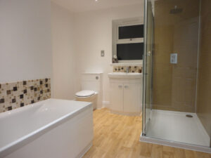 Completed bathroom with spacious shower.