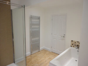 Completed bathroom with spacious shower.