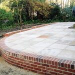 Radial Wall | To front of property. Location, West Mersea