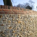 Traditional Stone Flint Walling | incorporating Flemmish Bond Brickwork with white Cement & Lime.