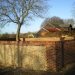 Traditional Stone Flint Walling | incorporating Flemmish Bond Brickwork with white Cement & Lime.