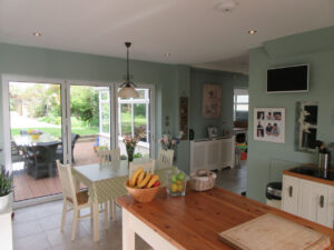 Large folding rear doors open the kitchen to the beautiful garden.