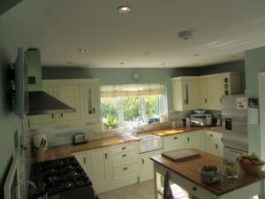 A classic country styled kitchen with free standing island.