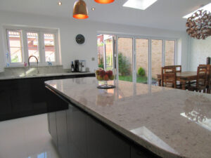 Granite worktops compliment the high gloss doors.