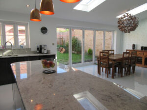 The roof windows and folding doors provide the finished extension with an abundance of light, the spacious family kitchen / diner is complete.