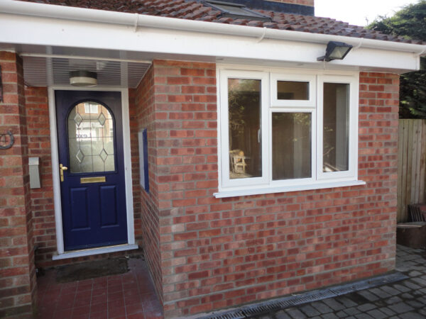 Completed exterior - carefully matched brickwork creates a seamless finish.