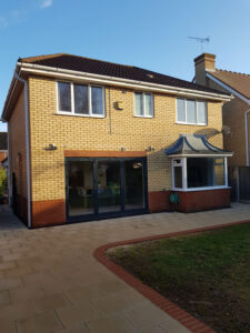 Exterior New aluminium bi folding doors installed and a new patio area.