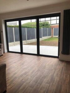 New aluminium bi folding doors upright feature radiators and karndene flooring.