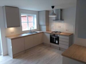 New modern kitchen incorporating downlights , splash backs and matching karndene flooring.