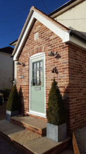 The finished porch transforms the front of the property.