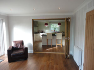 The converted garage has been transformed into a spacious downstairs room.